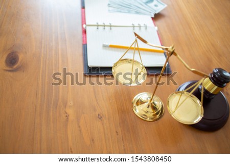 Justice law Scales and books and wooden gavel tool on desk in  Lawyer office.concept
