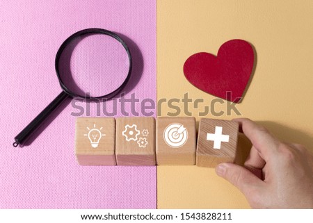 Man hand arranging wood block with business strategy goal icon and action plan in healthcare.