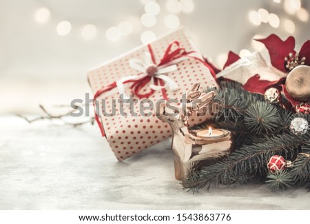 Christmas holiday background with gift in box . Lights, Christmas tree and Christmas balls.