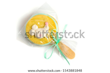 A symbolic sandwich cookie with cream on a stick with an image of a mouse, rat.  Symbol of the new year 2020.  Dessert, treat, gift.