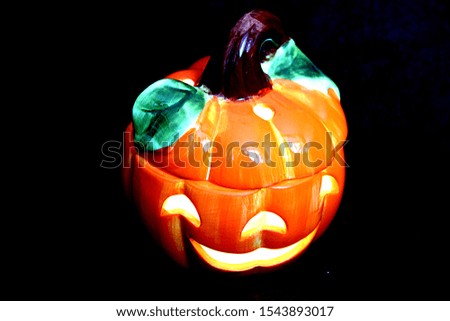 clay candlestick pumpkin halloween close-up dark background
