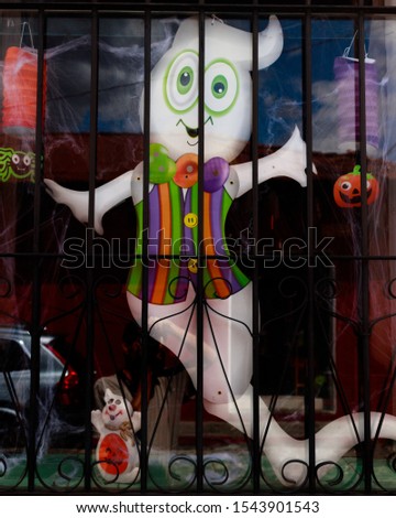 Halloween ghost decoration in a window 