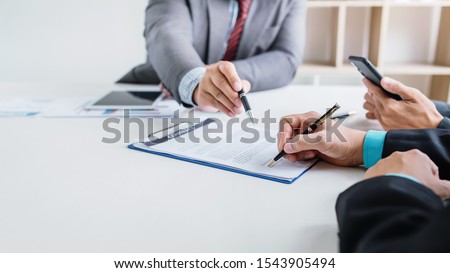 Business people sign financial business contract.