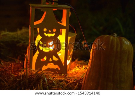 Halloween - Wooden lantern with a candle with the image of a pumpkin