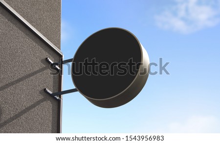 Blank black outdoor round signage mockup wall mounted, sky background. Empty avert baner for commission shop mock up. Clear teahouse or noshery hanging display for logo mokcup template.