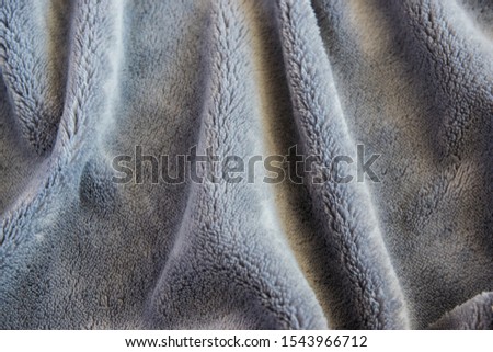 Texture fabric. Textile warm grey knitted cloth background.