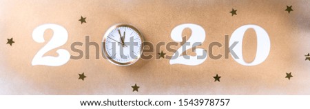Happy New Year 2020 . Festive Shining  composition on isolated background with gold clock and glitter.Flat lay, top view, copy space.