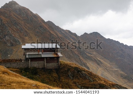 View of Transfagarash highway and valley in mountains of Romania. Tourist view mountain road. Autumn mountain landscape