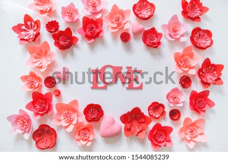 Pink and red flower made of paper. Shape frame place for text. Holiday of all lovers. White background.