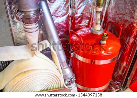 Fire cupboard. Fire hose. Concept - human security. Flame extinguisher. Firehose. Firehose at the enterprise. Equipment for emergency situations. Fire safety. Extinguishing equipment.