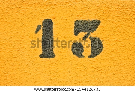 13, number thirteen, black digits on graduated orange / saturated yellow background.