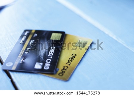 Credit card Placed on a blue wooden table With copy spaces Online shopping concepts