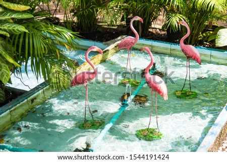 The flamingo bird sculpture used to decorate the garden.