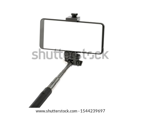 selfie stick with phone isolated without shadow clipping path Royalty-Free Stock Photo #1544239697