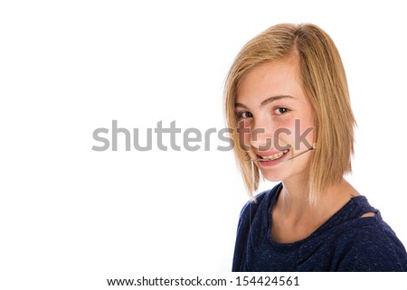 A pretty young girl wearing dental headgear Royalty-Free Stock Photo #154424561