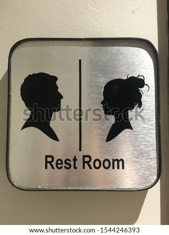 Male female rest room sign