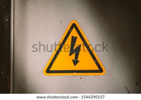 yellow triangular sign of electricity