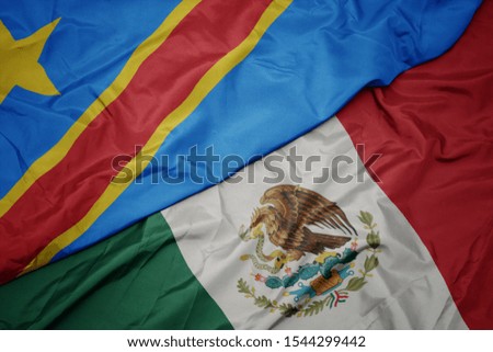 waving colorful flag of mexico and national flag of democratic republic of the congo. macro