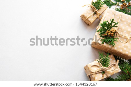Christmas gift boxes with fir  on white background. Copy space. Top view, flat lay