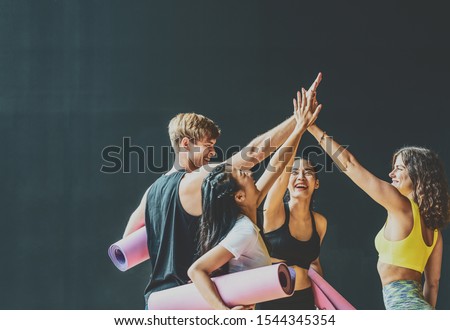 Group of diversity sporty people talking and celebrating by give me five with happiness, wearing sportswear bra and pants fashion, posture position, sport club community, sports and healthcare concept Royalty-Free Stock Photo #1544345354