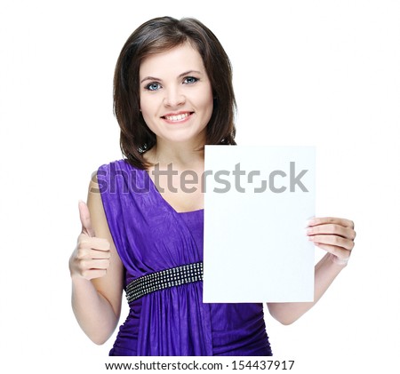 Attractive young woman in a violet dress. Holds a poster and showing thumbs up. Isolated on white background