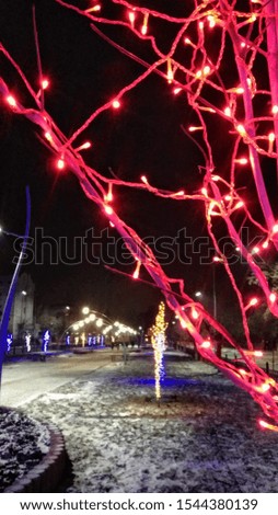 Christmas lights with red color on the street