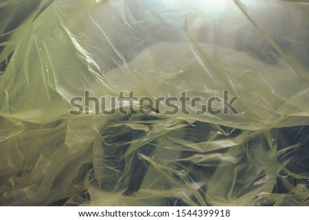 Beautiful yellow plastic bag abstract  background. No Plastic Bag Concept, save world, protect earth.