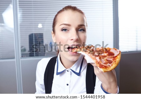 businesswomen with pizza in the office
