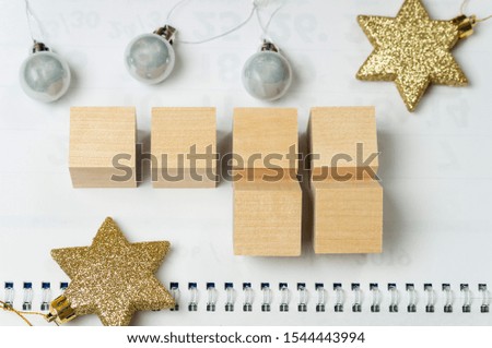 wooden blocks with empty space, a blank for the design of the calendar with Christmas toys