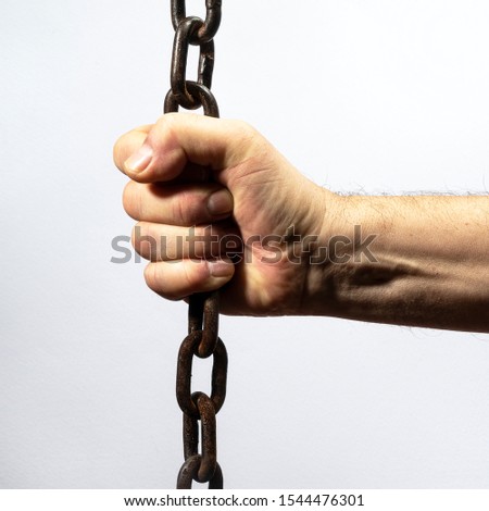 the hand holding the chain