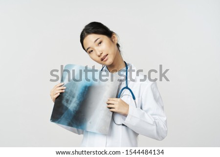 Female doctor x-ray diagnosis treatment of patient