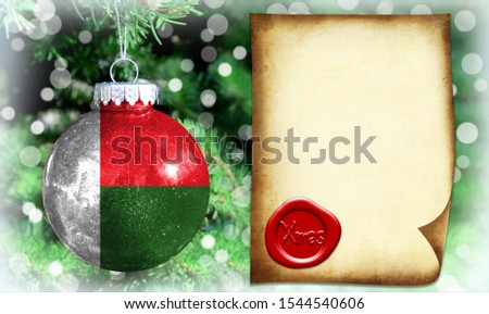 Christmas and New Year background with a flag of Madagascar. There is a place for your text in the photo
