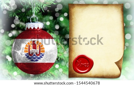Christmas and New Year background with a flag of French Polynesia. There is a place for your text in the photo