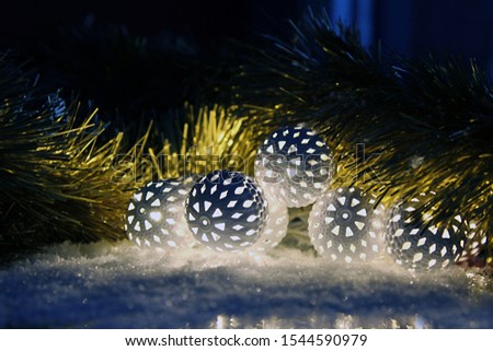 Christmas balls shining on the snow.