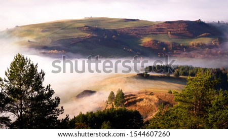 Beautiful, colorful autumn panorama of Pieniny Mountains (Male Pieniny) in the fog and morning light, Poland, Slovakia