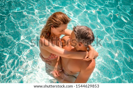 embracing love couple within summer spa hotel