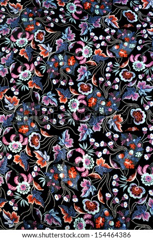 Colorful floral arabesque on black background