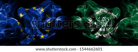 Eu, European union vs Arab League smoke flags placed side by side. Thick colored silky smokes abstract flags 