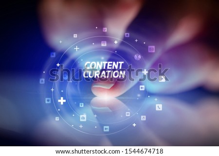 Finger touching tablet with social media icons and CONTENT CURATION
