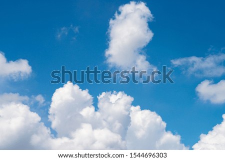 White clouds on a blue sky.