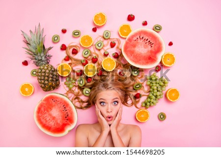 Close up top above high angle view photo beautiful she her lady lying down among different half slices fruits long volume hair afraid scared vegetables spoiled bad not fresh isolated pink background