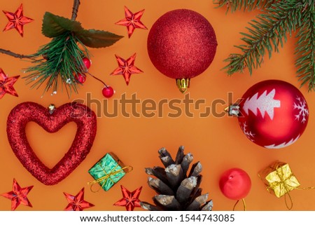 Creative Composition Useful for Christmas and New Year Greeting Card Created Using Decorative Christmas Balls, Pine Branch, Red Stars, Red Heart and Colorful Gift Boxes