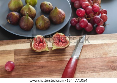 Figs and grapes on the kitchen table 