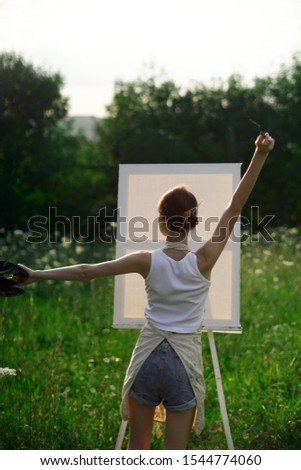 young slim woman with a beautiful smile easel