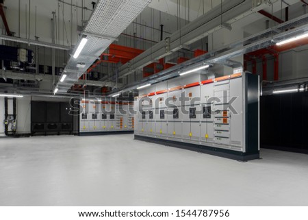 Low voltage switchboard. Electrical switch panel of switchgear room at power plant. Royalty-Free Stock Photo #1544787956