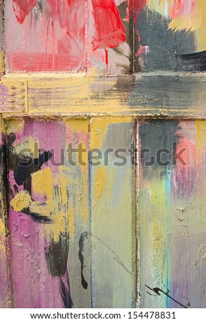 Detail of a brightly painted wooden fence.