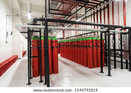 Powerful industrial fire extinguishing system room. Royalty-Free Stock Photo #1544792819
