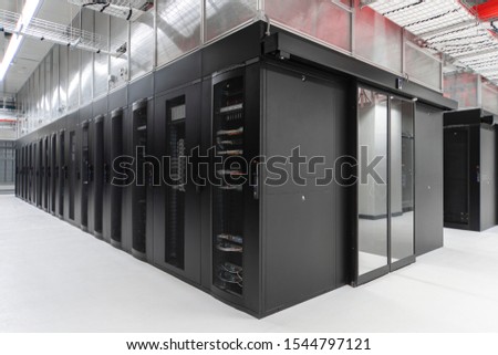 Shot of a long hallway full server racks in a modern data center. Server room.
 Royalty-Free Stock Photo #1544797121