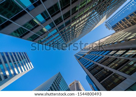 Modern office glasses buildings cityscape under blue clear sky in Washington DC, USA, outdoors financial skyscraper concept, symmetric and perspective architecture