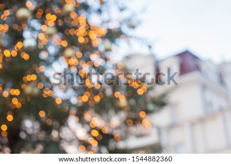 Defocused abstract Christmas tree on city street
